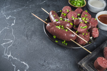 Korean traditional national food. Street home Asian cuisine. Sliced blood sausage soondae or...