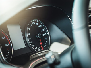 The sign and symbol on car dashboard. Car speedometer closeup. Car interior.