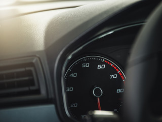 The sign and symbol on car dashboard. Car speedometer closeup. Car interior.