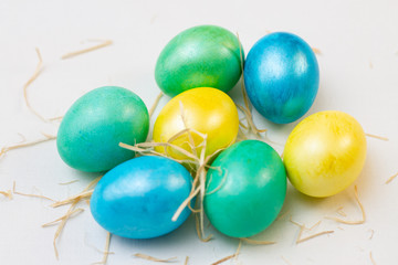 set of bright multi-colored easter eggs on white