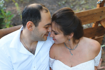 Fototapeta premium couple with closed eyes on bench