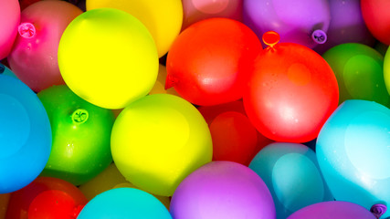 Fototapeta na wymiar Many bright and colorful water balloons