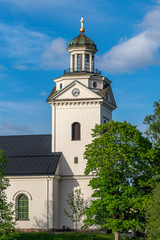 Obraz premium White church in Sweden in summer sunlight