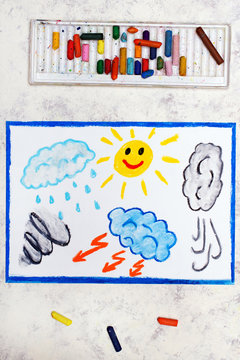 Photo of colorful drawing: Seasons and weather. Hand drawn weather illustrations: sun, rain, wind, storm