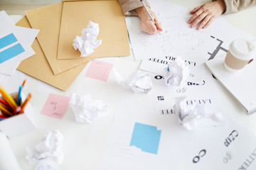 Background image of female hands doing lettering design for typography on table in workshop, copy space