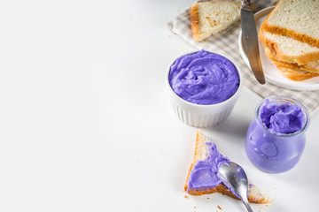 Ube Halaya. Halayang Ube. Trendy purple halaya yam jam, Filipino sweet and sour breakfast spread recipe, in different jar with toasted bread