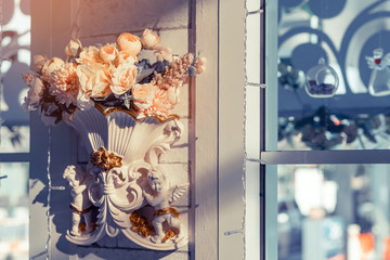 Many artificial pink and white roses are decorated on the wall to the backdrop in the wedding day. Beautiful flowers background, Selective focus.