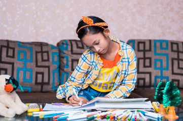 Happy little Cute little preschooler child drawing at home