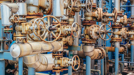 Industrial zone,The equipment of oil refining,Close-up of industrial pipelines of an oil-refinery plant,Detail of oil pipeline with valves in large oil refinery.