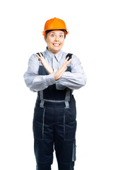 the builder girl is scared. With a gesture of her hand, she shows a stop. Isolated