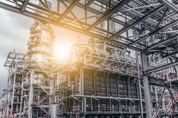 Fototapeta premium Industrial zone,The equipment of oil refining,Close-up of industrial pipelines of an oil-refinery plant,Detail of oil pipeline with valves in large oil refinery.