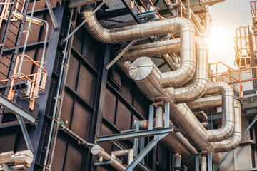 Industrial zone,The equipment of oil refining,Close-up of industrial pipelines of an oil-refinery plant,Detail of oil pipeline with valves in large oil refinery.