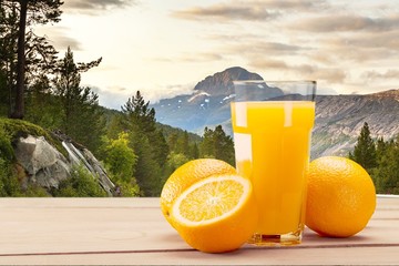 Orange juice and slices of orange on desk © BillionPhotos.com