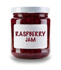 SIngle jar of Raspberry jam, with white label saying Raspberry jam, isolated on a white background