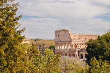 City panorama Rome, Italy Colosseum or Coliseum ancient ruins background blue sky stone arches and sunset