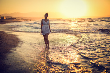 Carefree Woman Enjoying Beautiful Sunset