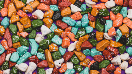 Candy pebbles background. sweets in the form of colored stones