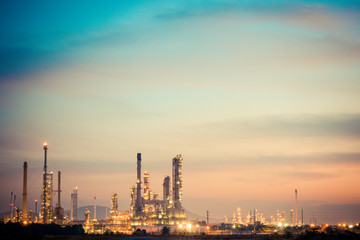 Fototapeta premium Aerial view oil refinery night background during twilight,Industrial zone,Energy power station.