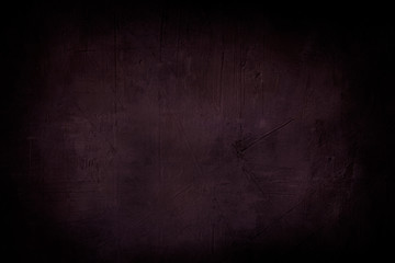 dark purple grunge background or texture with black vignette borders