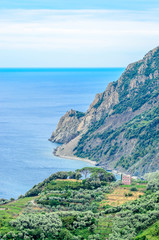 Majestic mountain ocean view from famous trail between Monterosso and Vernazza, Italy.