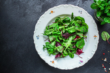 Healthy salad, leaves mix salad (mix micro greens, juicy snack). food background - copy space