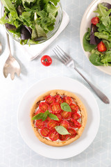 tomato quiche with cheese and lettuce