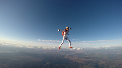 Adrenaline. Extreme sky for free people. No rules in open air. Parachutist in professional suit is in free fall. Skydiving is a sport of the future.  