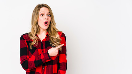 Young cauciasian woman isolated on white background pointing to the side