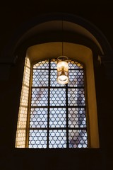 Beautiful window and a lamp in the german catholic church