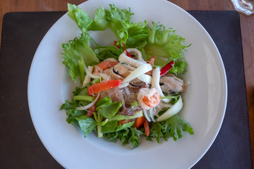 Fresh salad with seafood and tomato. Sea food salad.