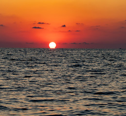 Evening sunset of crimson sun over the Black Sea
