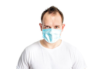 Portrait of serious and self confident caucasian man in blue medical mask on face. Health care in cold season. Prevention of coronavirus covid-2019. Stop coronavirus. Medical and health care.