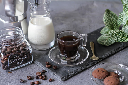 Photo of coffee with milk and homemade cookies. Espresso coffee. Dark background. Image.