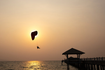 Silhouette Paramotor team over sky againt sen set © naraichal