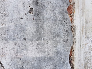 Vintage Rough old cement concrete wall surface and orange crack brick wall texture for background abstract or wallpaper concept.