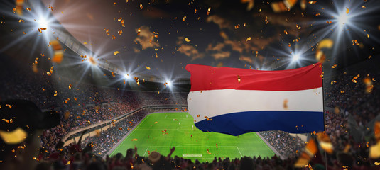 Soccer game in the stadium with Netherlands/Holland flag