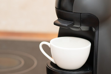 Making coffee in a capsule machine.