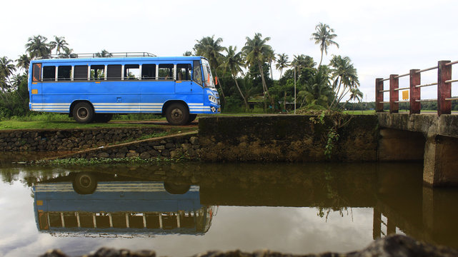 Reflection of bus in river at Kerala, India.