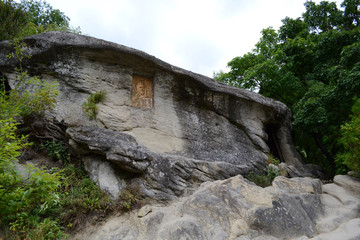 Fototapeta na wymiar Cave of Turnu Monastery. Turnu Monastery is one of the most sacred Christian monastic dwellings of the Ramnic Diocese.