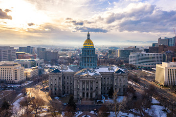 Colorado State Capitol Building & the City of Denver Colorado at Sunset.  Rocky Mountains on the...