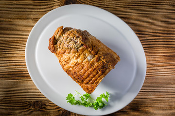 Baked rolled bacon with spices.
