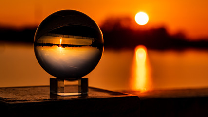 Crystal ball sunset shot at Plattling, Isar, Bavaria, Germany