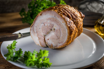 Baked rolled bacon with spices.