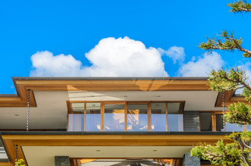 The roof of the house with nice window.