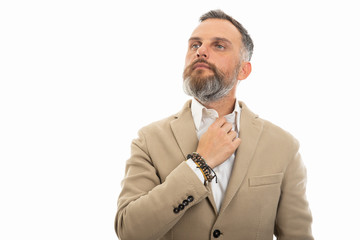 Portrait of man wearing smart casual clothes arranging shirt