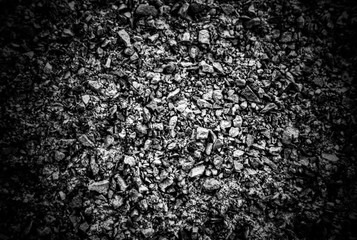 A background of pebbles in black and white close up view