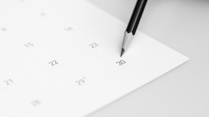 The pencil points to the 30 in the calendar.