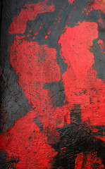 Red and black acrylic paint background.