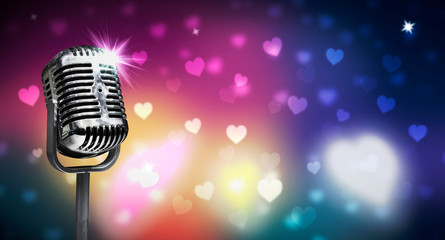 Close up vintage microphone on colorful background, music concert