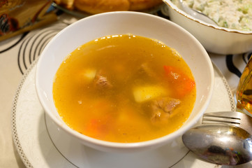 Meat soup in plate on a table